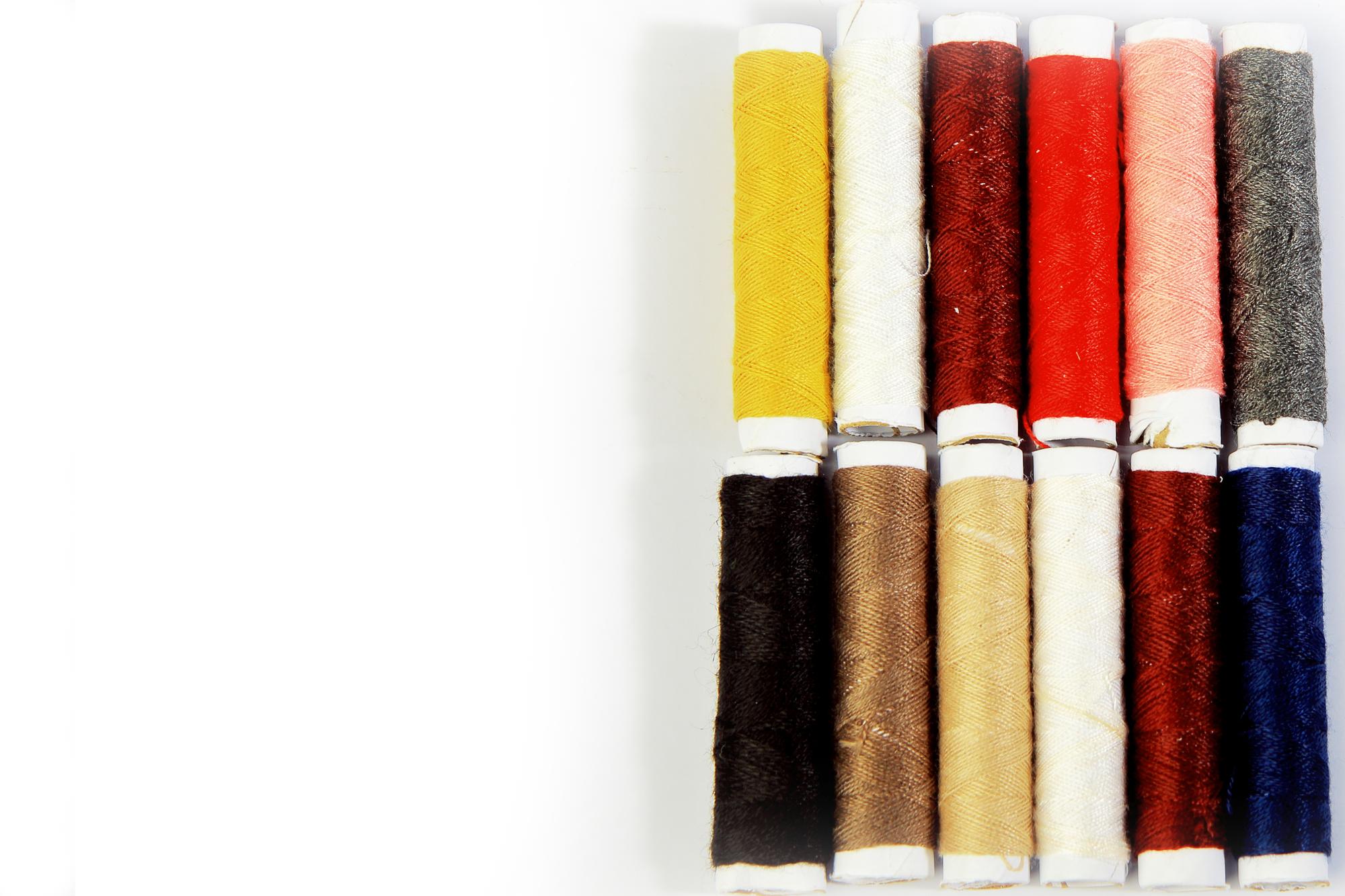 Sample swatches with thread spools